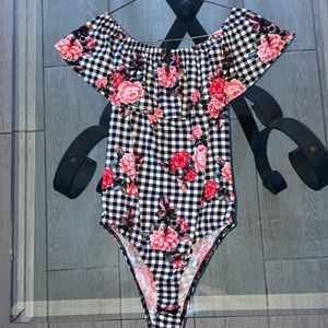 Ross, black and White and has printed pink flowers